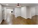 Spacious living room featuring dark wood floors, stylish doors, and an open view into the dining area at 3695 Fox Hills Se Dr, Marietta, GA 30067