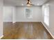 Bright living room with hardwood floors, a ceiling fan, and natural light streaming through the windows at 3695 Fox Hills Se Dr, Marietta, GA 30067