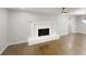 Cozy living room showcasing a brick fireplace and hardwood floors at 3695 Fox Hills Se Dr, Marietta, GA 30067