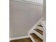 Wooden staircase with white trim leads to the next level of the home at 3695 Fox Hills Se Dr, Marietta, GA 30067