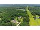 Stunning aerial view showcasing the home's secluded, wooded location and expansive surroundings at 90 Mckown Rd, Fayetteville, GA 30214