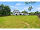 Expansive backyard with lush green grass and a modern home in the background at 90 Mckown Rd, Fayetteville, GA 30214