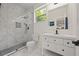 Beautiful bathroom with a glass shower, white vanity, and modern fixtures at 90 Mckown Rd, Fayetteville, GA 30214
