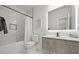 Sleek bathroom featuring marble tile, a modern vanity and a well-lit mirror at 90 Mckown Rd, Fayetteville, GA 30214