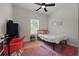 Cozy bedroom featuring a twin bed, desk and chair, and colorful rug at 90 Mckown Rd, Fayetteville, GA 30214