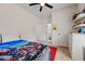 Bedroom with a bed featuring a superhero cover, leading to a walk-in closet and bathroom at 90 Mckown Rd, Fayetteville, GA 30214