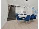 Dining room with glass-enclosed room, staircase, modern lighting, and seating for eight at 90 Mckown Rd, Fayetteville, GA 30214