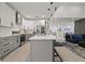 Bright, modern kitchen with stainless appliances, a center island and contemporary finishes at 90 Mckown Rd, Fayetteville, GA 30214