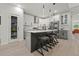 Modern kitchen with gray cabinets, quartz countertops, and stainless steel appliances at 90 Mckown Rd, Fayetteville, GA 30214
