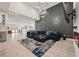 Open-concept living room with modern decor, high ceilings and beautiful natural light at 90 Mckown Rd, Fayetteville, GA 30214