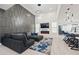 Spacious open concept living area with modern decor, a fireplace and open to kitchen at 90 Mckown Rd, Fayetteville, GA 30214