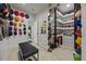 Large walk-in closet with built-in shelves and hanging racks, well-organized storage, and a comfortable bench at 90 Mckown Rd, Fayetteville, GA 30214