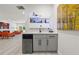 Entertainer's wet bar featuring wine refrigerator and open shelving display at 90 Mckown Rd, Fayetteville, GA 30214