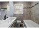 Bathroom featuring modern fixtures, a shower-tub combo, and lots of natural light at 1472 Norman Berry Dr, Atlanta, GA 30344