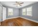 Bedroom with two windows, refinished hardwood floors and fresh paint at 1472 Norman Berry Dr, Atlanta, GA 30344
