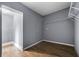 Walk-in closet with wood-look flooring, wire shelves, and light gray paint at 1472 Norman Berry Dr, Atlanta, GA 30344
