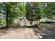Quaint single-story home with fenced-in backyard and mature trees at 1472 Norman Berry Dr, Atlanta, GA 30344