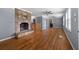Bright living room with a stone fireplace, hardwood floors, and lots of natural light at 1472 Norman Berry Dr, Atlanta, GA 30344