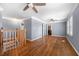 Open living room with hardwood floors, offering access to other rooms in the house at 1472 Norman Berry Dr, Atlanta, GA 30344
