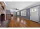 Spacious living room with hardwood floors, fireplace, and front entrance at 1472 Norman Berry Dr, Atlanta, GA 30344