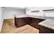 Basement bar featuring dark wood cabinets and granite countertops, offering a sleek and functional design at 2286 Capehart Ne Cir, Atlanta, GA 30345