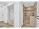 Modern bathroom featuring a tiled walk-in shower with convenient shelving, offering a sleek and functional design at 2286 Capehart Ne Cir, Atlanta, GA 30345