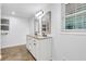 Modern bathroom featuring a double sink vanity, granite countertop, and updated fixtures at 2286 Capehart Ne Cir, Atlanta, GA 30345