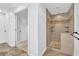 Bathroom boasting a custom tiled shower with built-in shelves and neutral color palette at 2286 Capehart Ne Cir, Atlanta, GA 30345