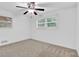 Spacious bedroom with ample natural light, ceiling fan, and neutral carpeting at 2286 Capehart Ne Cir, Atlanta, GA 30345