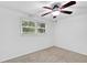 Bright bedroom with neutral carpet and ceiling fan, creating a serene and inviting space at 2286 Capehart Ne Cir, Atlanta, GA 30345