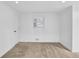 Bright bedroom featuring neutral carpet, crisp white walls, and a sunlit window at 2286 Capehart Ne Cir, Atlanta, GA 30345