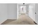 Neutral bedroom featuring French doors, carpet floors, and a peak into the bathroom at 2286 Capehart Ne Cir, Atlanta, GA 30345