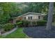 Charming brick home with mature trees, well-maintained landscaping, and inviting facade at 2286 Capehart Ne Cir, Atlanta, GA 30345