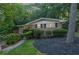 Charming brick home with a well-manicured front yard and lush greenery creating a serene and inviting atmosphere at 2286 Capehart Ne Cir, Atlanta, GA 30345