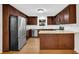 Updated kitchen with dark cabinets, stainless steel appliances, granite countertops, and center island at 2286 Capehart Ne Cir, Atlanta, GA 30345
