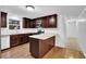 Bright kitchen with granite counters, stainless appliances, dark wood cabinets, and wood flooring at 2286 Capehart Ne Cir, Atlanta, GA 30345