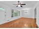 Bright living room featuring hardwood floors, ample natural light, and classic chandelier at 2286 Capehart Ne Cir, Atlanta, GA 30345