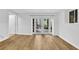 Bright room featuring beautiful light brown hardwood flooring and glass paneled doors to the outside at 2286 Capehart Ne Cir, Atlanta, GA 30345