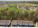 An aerial view of a home in a neighborhood surrounded by trees and greenery at 4457 Watson Ridge Dr, Stone Mountain, GA 30083