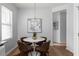 Cozy dining area featuring a white table, brown chairs, and bright natural light at 4457 Watson Ridge Dr, Stone Mountain, GA 30083