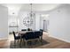 Hardwood dining room with hardwood floors, a chandelier, and a table with seating for six at 4457 Watson Ridge Dr, Stone Mountain, GA 30083