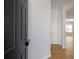 View of the home's entryway showing a hardwood floor and an entryway leading into other rooms of the house at 4457 Watson Ridge Dr, Stone Mountain, GA 30083