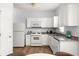 Bright kitchen featuring white cabinets, modern appliances, granite countertops, and hardwood floors at 4457 Watson Ridge Dr, Stone Mountain, GA 30083