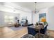 Bright living room featuring hardwood floors, comfortable furniture, and a formal dining area at 4457 Watson Ridge Dr, Stone Mountain, GA 30083