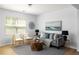 Bright living room featuring modern decor, comfortable seating, and natural light from a large window at 4457 Watson Ridge Dr, Stone Mountain, GA 30083