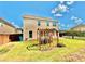Large backyard with pergola, grass, and partial fencing in a residential setting at 5599 Wheeler Ridge Rd, Auburn, GA 30011