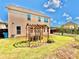 Well-maintained backyard featuring a wooden trellis and green grass at 5599 Wheeler Ridge Rd, Auburn, GA 30011