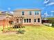 Backyard featuring a wooden trellis, a well-manicured lawn, and a patio at 5599 Wheeler Ridge Rd, Auburn, GA 30011