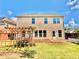 A green backyard with a wooden trellis, and a white picket fence at 5599 Wheeler Ridge Rd, Auburn, GA 30011