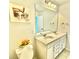 Bathroom featuring a double vanity, modern lighting, and wall art at 5599 Wheeler Ridge Rd, Auburn, GA 30011